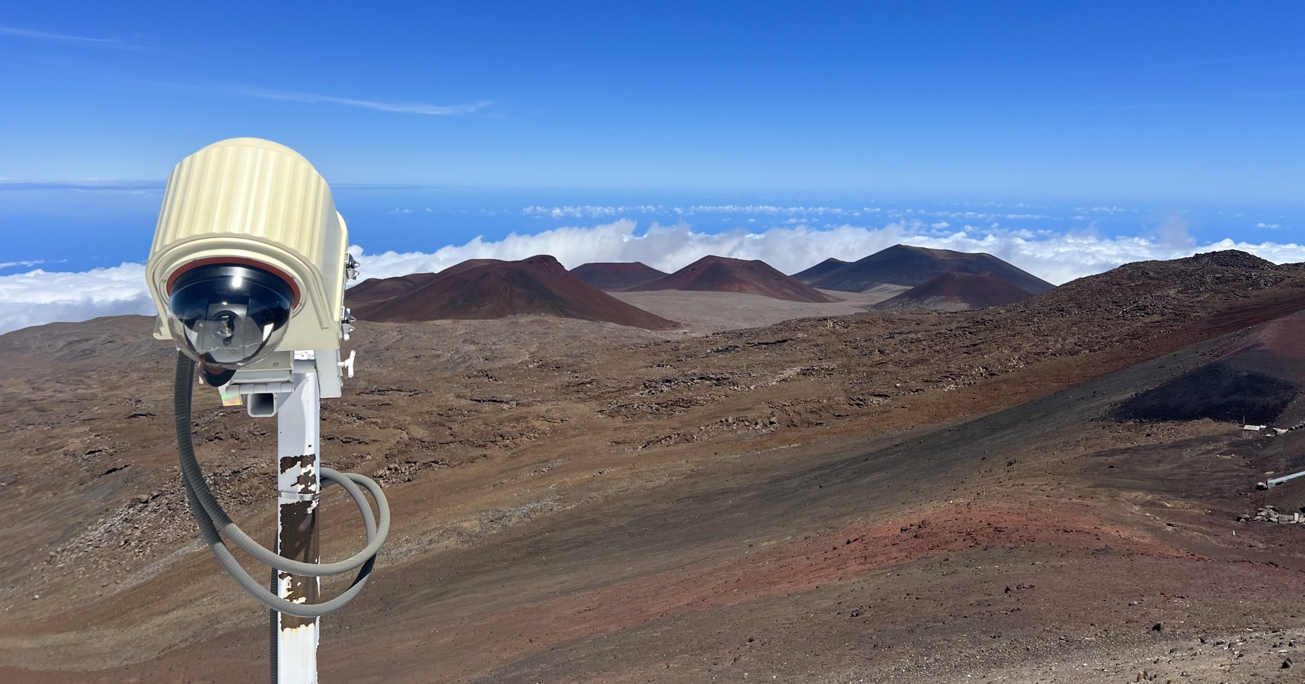 XRain Enclosure Installed on the NASA IRTF Telescope in Hawaii with the Landscape in the Background