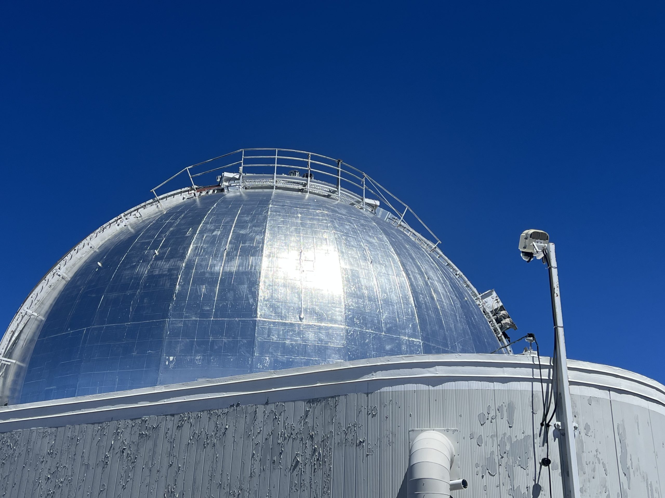 XRain Enclosure Installed on the NASA IRTF Telescope in Hawaii with the telescope in the background